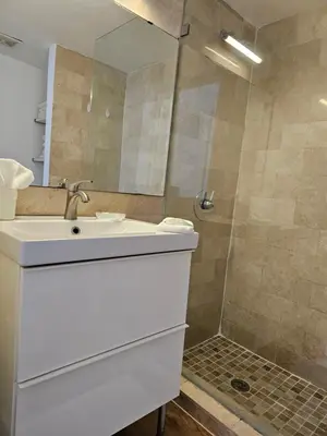 a bathroom with a sink and a shower at Bright 1BedRoom RENOVATED NEAR THE BEACH (4PPL) in Miami Beach