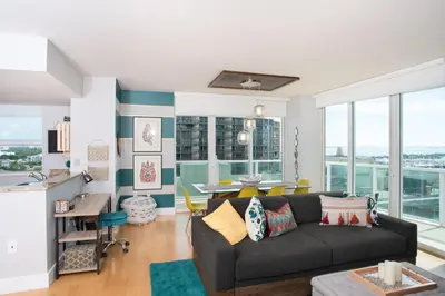 a living room with a couch and a table at Coconut Grove 2 bedroom Apartment Amazing Views Includes Parking in Miami