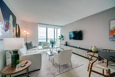 a living room with a couch and a table at Direct Bayview One Bedroom Condo in Coconut Grove Includes parking in Miami
