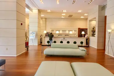a living room with a couch and a table at Connecting Rooms-Coconut Grove 10th Floor- Parking Included in Miami