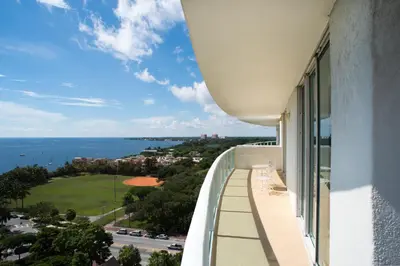 a balcony with a view of the ocean at Gorgeous Coconut Grove 3 bedroom Condo with amazing views Parking Included in Miami