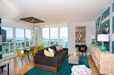 a living room with a couch and a table at Gorgeous Coconut Grove 3 bedroom Condo with amazing views Parking Included in Miami