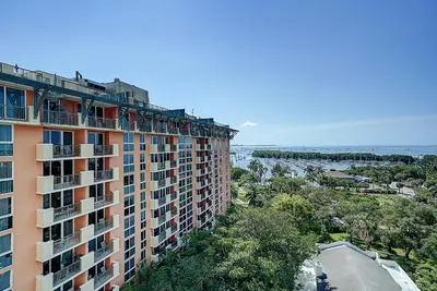 an apartment building with a view of the ocean at Coconut Grove Retreat 1 bedroom apartment with Bay views in Miami