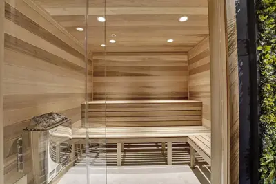 a sauna with a bench in a wooden wall at Beach Resort condo 921 in Miami Beach