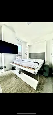 a white bedroom with a large bed in it at Ocean View Cozy Studio Pool and Gym in Miami