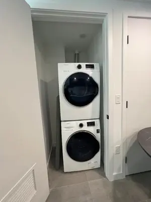 a washer and dryer in a small room at Ocean view Studio Pool and gym in Miami