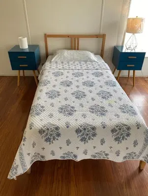 a bedroom with a bed with a blue and white bedspread at 1233 Apartment 4 Miami in Tamiami
