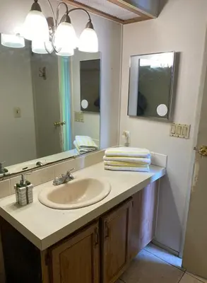 a bathroom with a sink and a mirror at 1233 Apartment 4 Miami in Tamiami