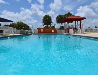 a large blue swimming pool with a gazebo at 1233 Apartment 4 Miami in Tamiami