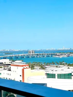 a view of the water with buildings and a bridge at Upscale Ocean View Studio Pool and Gym in Miami
