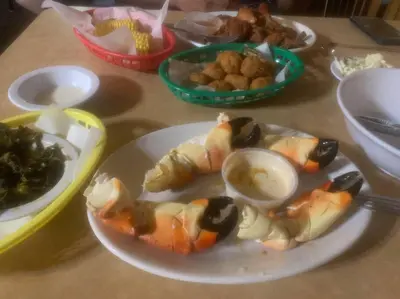 a table with a plate of food with sushi at Tropical Classic Retro Florida, Private 2 bedroom Suite with Best Location in Fort Lauderdale