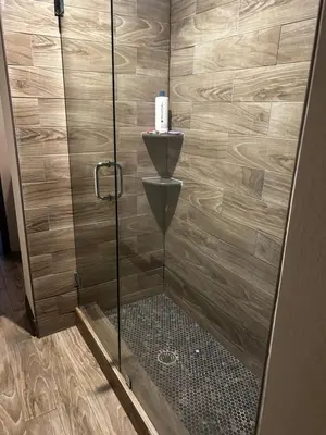 a shower with a glass door in a bathroom at cozy studio apartment with private entrance and patio in Miami