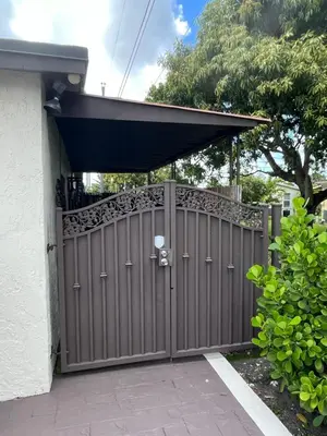 a wooden gate with awning on a house at cozy studio apartment with private entrance and patio in Miami