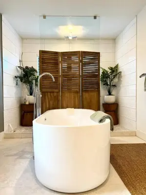 a large white tub in a bathroom with a shower at Super stylish 4 BR Home Steps from the Fun in Fort Lauderdale