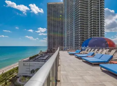 a view of the beach from the balcony of a building at Spectacular ocean and beach view in Hollywood