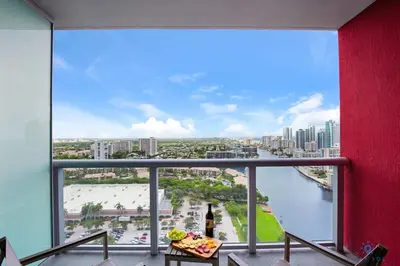 a room with a large window with a view of a river at Beachwalk Studio Amazing View Pininfarina Design in Hallandale Beach
