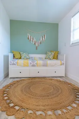 a bedroom with a bed with a large rug at Private Villa with Pool and Sauna in Dania Beach