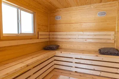 an empty wooden sauna with two pillows in it at Private Villa with Pool and Sauna in Dania Beach
