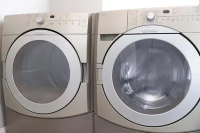 a white washing machine sitting next to a washer at Private Villa with Pool and Sauna in Dania Beach
