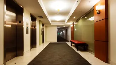 a long hallway with a red bench and a carpet at Apt w/2 Queen Beds & Ocean View at Tides in Hollywood