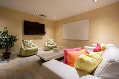 a living room with two couches and a flat screen tv at Brickell High Rise Living at its best! w/ Pool Gym in Miami