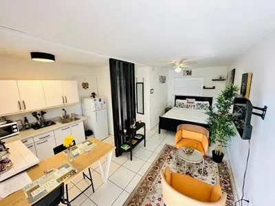 a small living room with a kitchen and a living room at Cozy apartment near Seminole Hard Rock Cafe in Hollywood