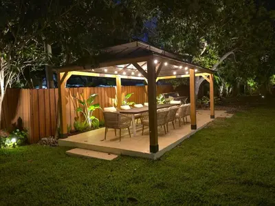 a gazebo with a table and chairs in a yard at Villa Santa Maria in Cutler Bay