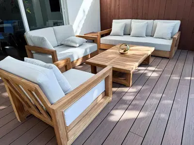 a patio with two couches and a table and a table at Villa Santa Maria in Cutler Bay
