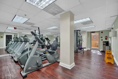 a gym with treadmills and elliptical machines at Modern Bay View Balcony In The Grove Free Parking in Miami