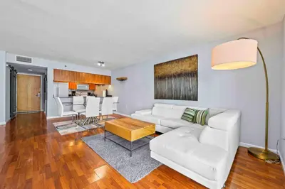 a living room with a white couch and a table at Luxe 1 BDR • 32th Floor • Brickell • Ocean Views in Miami