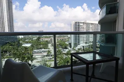 a balcony with a table and a view of a city at Apt w/2 Queen Beds & Canal View at Tides in Hollywood