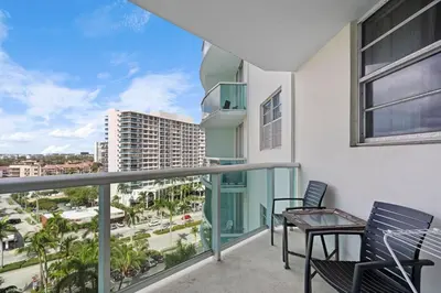 a balcony with chairs and a view of a city at Apt w/2 Queen Beds & Canal View at Tides in Hollywood