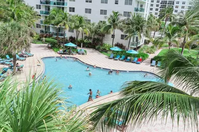an overhead view of a swimming pool at a resort at 2Bed/2Bath, 4QueenBeds & OceanView at Tides in Hollywood