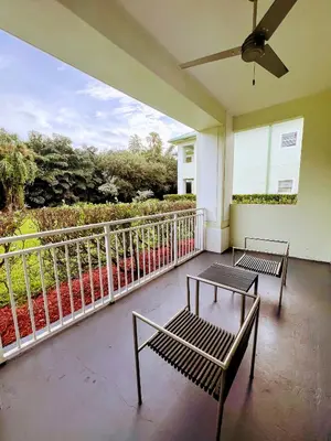 two benches sitting on a porch with a balcony at Doral Pool 1107 by Wave Properties in Miami
