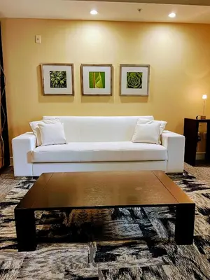 a living room with a white couch and a coffee table at Doral Pool 1107 by Wave Properties in Miami