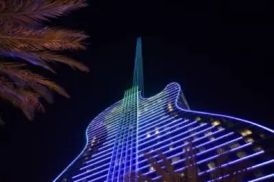 a tall building with blue and green lights on it at Casa Mojito in Fort Lauderdale