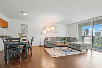 a living room with a couch and a table at Comfy 28th floor • Brickell • Ocean & City Views in Miami