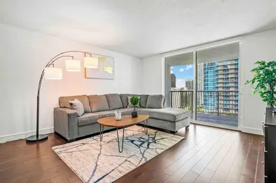 a living room with a couch and a table at Comfy 28th floor • Brickell • Ocean & City Views in Miami