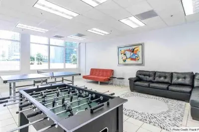 a large living room with a large foosball table at Comfy 28th floor • Brickell • Ocean & City Views in Miami