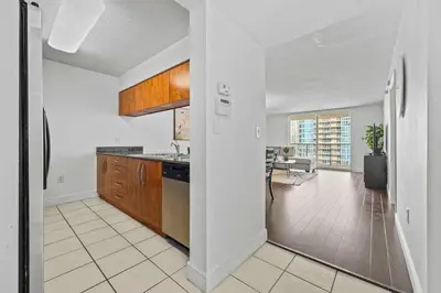 an open kitchen and living room in a house at Comfy 28th floor • Brickell • Ocean & City Views in Miami