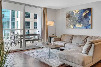a living room with a couch and a table at Beautiful 1 BED 1 BTH • Brickell in Miami