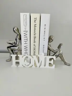 a shelf with books and trophies on it at Stylish 1-Bedroom Getaway Apt- pool & gym in Miami