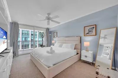 a bedroom with a large bed and a balcony at PH 41st Floor 3 BED • Brickell • Ocean View in Miami