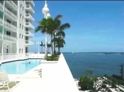 a swimming pool with a view of the ocean at Dazzling 1 BED 1 BTH • Brickell • Bay & City View in Miami
