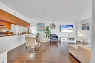 a living room with a couch and a table at Dazzling 1 BED 1 BTH • Brickell • Bay & City View in Miami