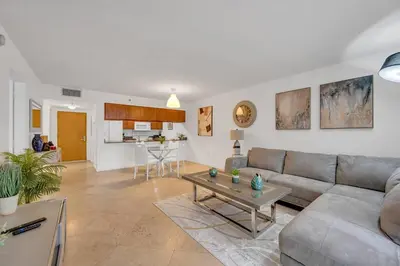 a living room with a couch and a table at Ocean view 1BR Condo Brickell-FreeParking in Miami
