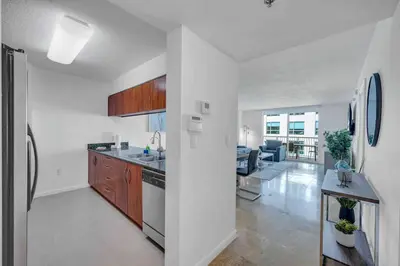 a kitchen with a sink and a stove top oven at Spacious 36th FLR 1 BD 1 BT • Brickell • Bay View in Miami