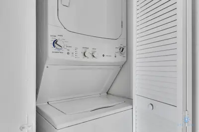 an empty white refrigerator with its door open at Beachwalk Resort infinity Pool Balcony Views in Hallandale Beach