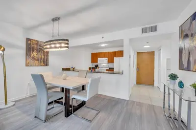 a dining room and kitchen with a table and chairs at Beautiful 1 Bed 1 Bath • Brickell • Bay View in Miami