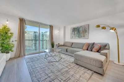 a living room with a couch and a table at Beautiful 1 Bed 1 Bath • Brickell • Bay View in Miami